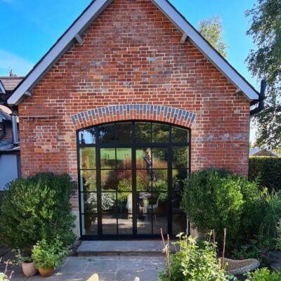 steel look doors in wiltshire house to a table brick extension