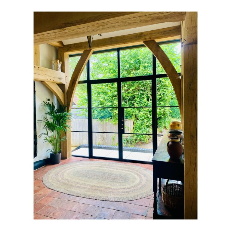 steel replacement French doors in a room with timber beams