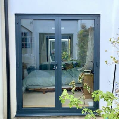 Bifolding doors as French doors in a grey colour