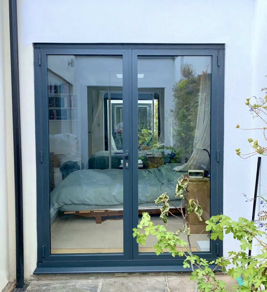 Bifolding doors as French doors in a grey colour